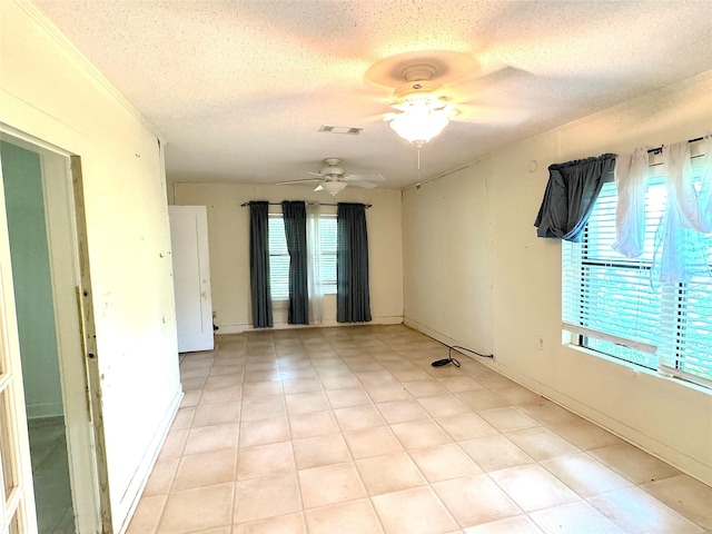 202 Powell Rd, Weatherford, TX 76088 - unfurnished room with healthy amount of natural light, a textured ceiling, and ceiling fan