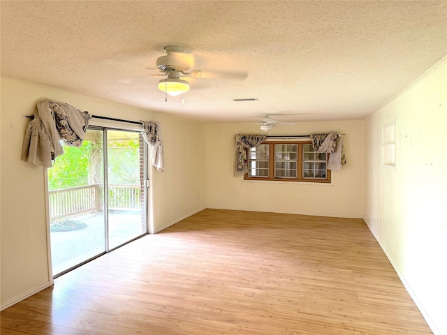 202 Powell Rd, Weatherford, TX 76088 - empty room with light wood-type flooring, a textured ceiling, and ceiling fan