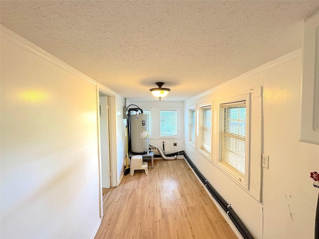 202 Powell Rd, Weatherford, TX 76088 - hall with water heater, a textured ceiling, light wood-style floors, ornamental molding, and baseboards