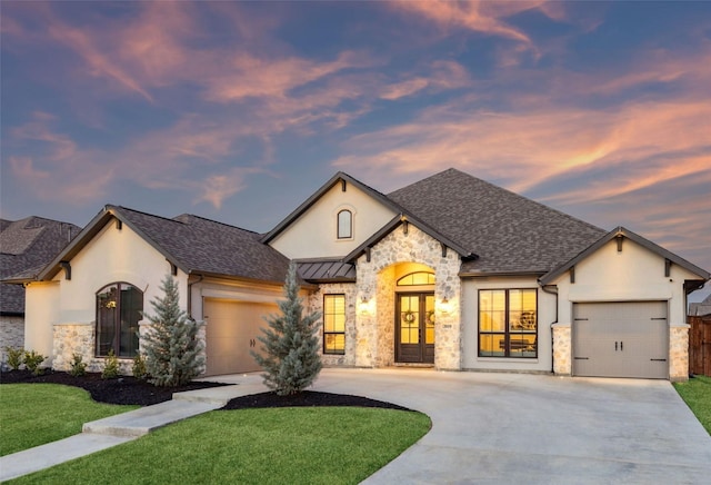 2019 Stargrass Rd, Haslet, TX 76052 - french country style house featuring an attached garage, stone siding, driveway, stucco siding, and a lawn