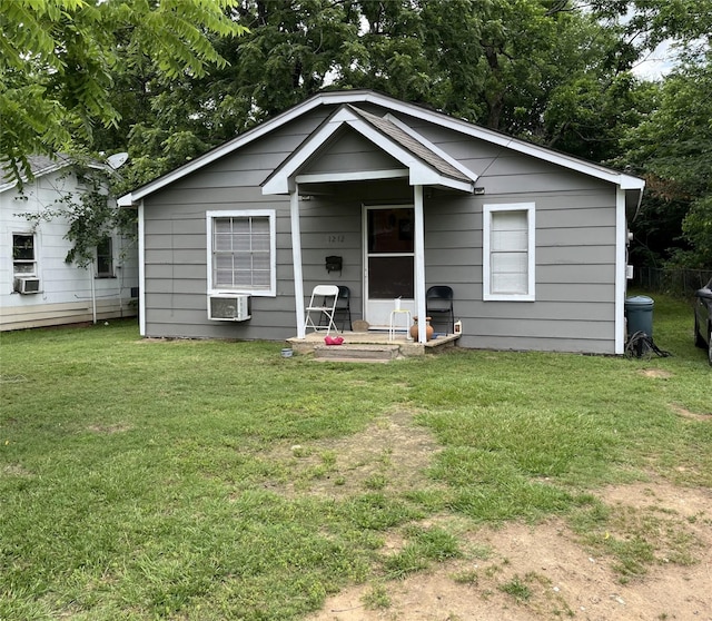 1212 W Cherry St, Paris, TX 75460 - view of front of home featuring a front lawn and cooling unit
