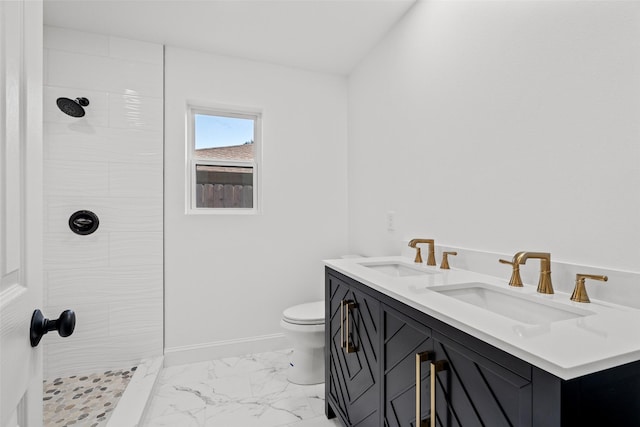11832 Cromwell Dr, Dallas, TX 75234 - bathroom with tiled shower, marble finish floors, double vanity, toilet, and baseboards