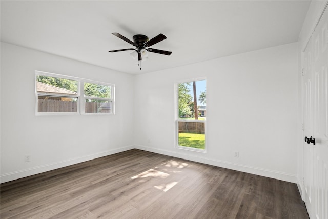 11832 Cromwell Dr, Dallas, TX 75234 - empty room with baseboards, wood finished floors, and a ceiling fan