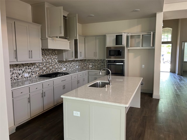 1308 Carlet Dr, Little Elm, TX 75068 - kitchen featuring stainless steel appliances, a sink, dark wood-style flooring, and tasteful backsplash