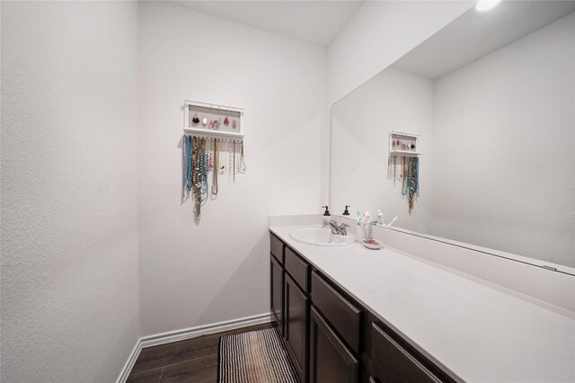 2212 Rosemary Way, Anna, TX 75409 - bathroom with wood finished floors, vanity, and baseboards