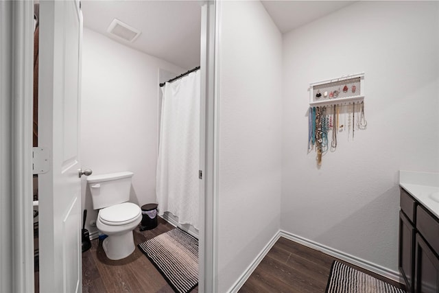 2212 Rosemary Way, Anna, TX 75409 - bathroom with vanity, toilet, wood finished floors, a shower with curtain, and baseboards
