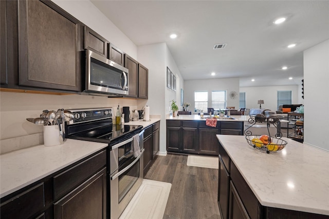 2212 Rosemary Way, Anna, TX 75409 - kitchen with stainless steel appliances, dark wood-style flooring, dark brown cabinets, open floor plan, and recessed lighting