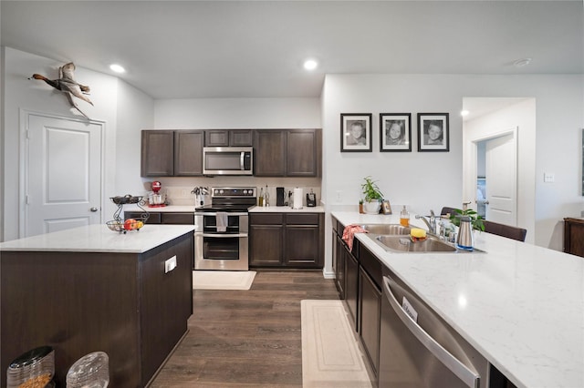 2212 Rosemary Way, Anna, TX 75409 - kitchen featuring stainless steel appliances, a sink, dark wood finished floors, dark brown cabinets, and recessed lighting