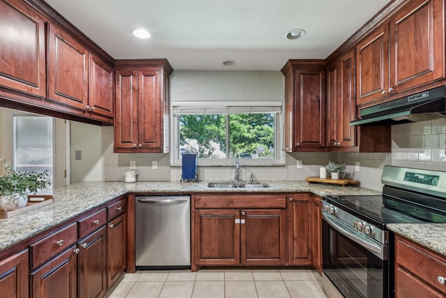 3233 Princess St, Bedford, TX 76021 - kitchen featuring stainless steel appliances, under cabinet range hood, a sink, tasteful backsplash, and light stone counters