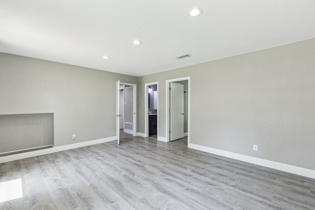3233 Princess St, Bedford, TX 76021 - unfurnished living room featuring baseboards, recessed lighting, and light wood-style flooring