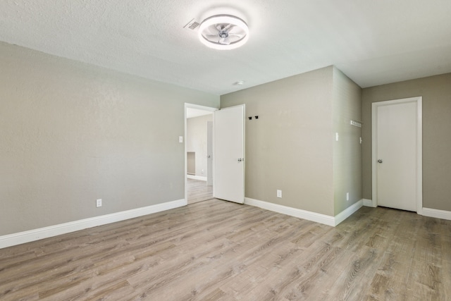 3233 Princess St, Bedford, TX 76021 - unfurnished room with wood finished floors and baseboards