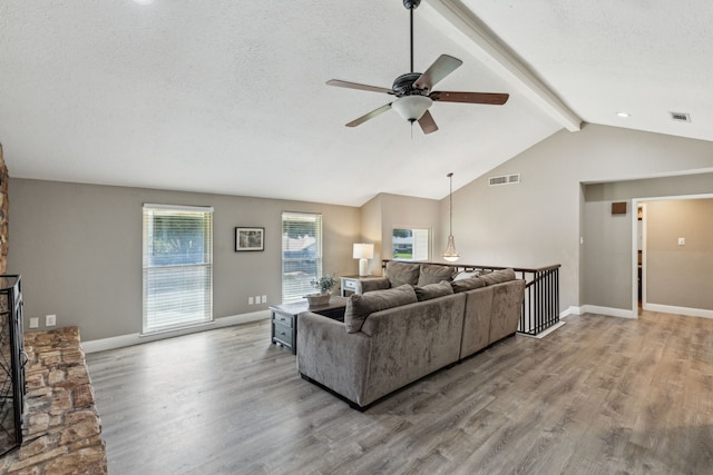 3233 Princess St, Bedford, TX 76021 - living area with ceiling fan, wood finished floors, a textured ceiling, and baseboards