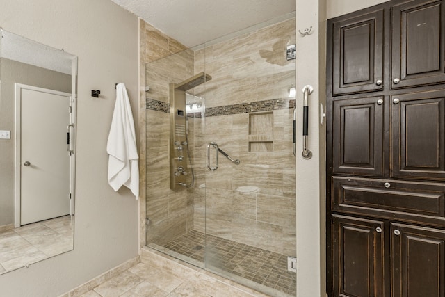 3233 Princess St, Bedford, TX 76021 - bathroom featuring a shower stall, baseboards, and tile patterned floors