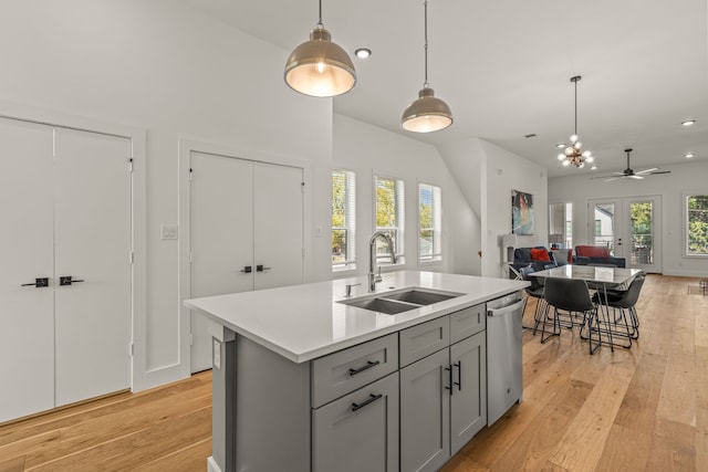 908 Muncie Ave, Dallas, TX 75212 - kitchen with dishwasher, a sink, gray cabinetry, open floor plan, and light wood finished floors