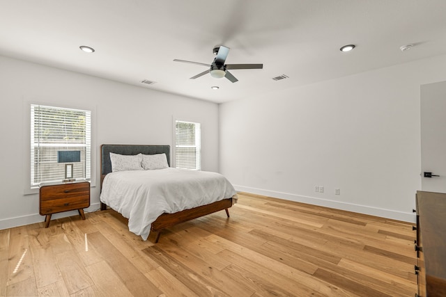908 Muncie Ave, Dallas, TX 75212 - bedroom featuring multiple windows, light wood finished floors, baseboards, and recessed lighting