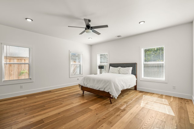 908 Muncie Ave, Dallas, TX 75212 - bedroom with light wood-style flooring, baseboards, ceiling fan, and recessed lighting