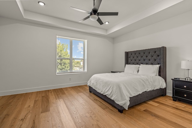 908 Muncie Ave, Dallas, TX 75212 - bedroom featuring a raised ceiling, light wood-style floors, baseboards, recessed lighting, and a ceiling fan