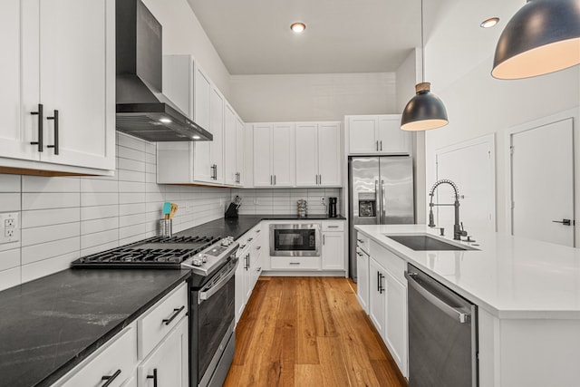 920 Muncie Ave, Dallas, TX 75212 - kitchen with wall chimney exhaust hood, stainless steel appliances, a sink, white cabinetry, and recessed lighting