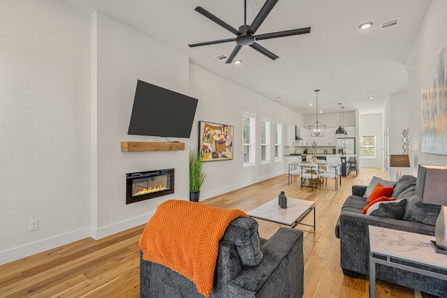 920 Muncie Ave, Dallas, TX 75212 - living area with a ceiling fan, healthy amount of natural light, baseboards, a glass covered fireplace, and recessed lighting
