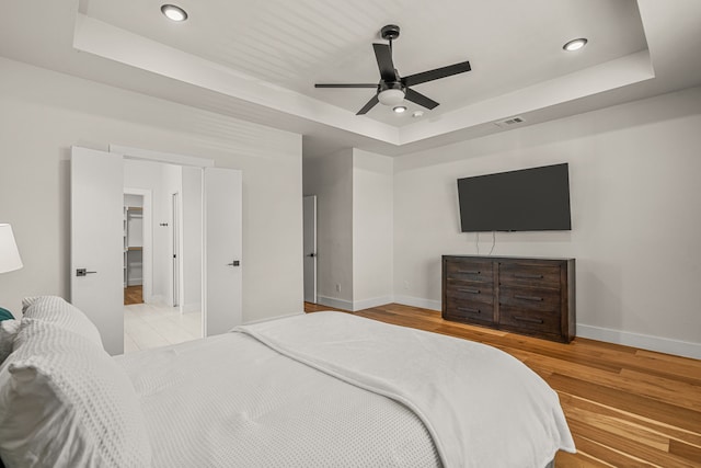 920 Muncie Ave, Dallas, TX 75212 - bedroom with a raised ceiling, baseboards, recessed lighting, wood finished floors, and a ceiling fan