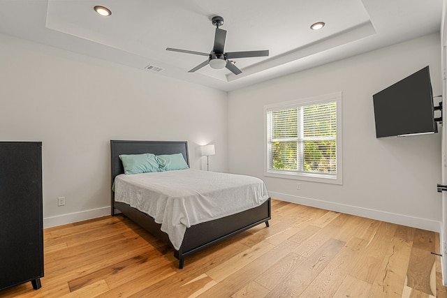 920 Muncie Ave, Dallas, TX 75212 - bedroom featuring a tray ceiling, baseboards, recessed lighting, light wood-type flooring, and a ceiling fan