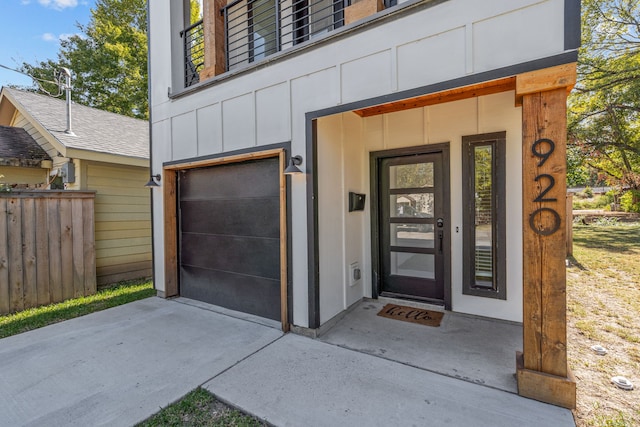 920 Muncie Ave, Dallas, TX 75212 - view of exterior entry with board and batten siding and an attached garage
