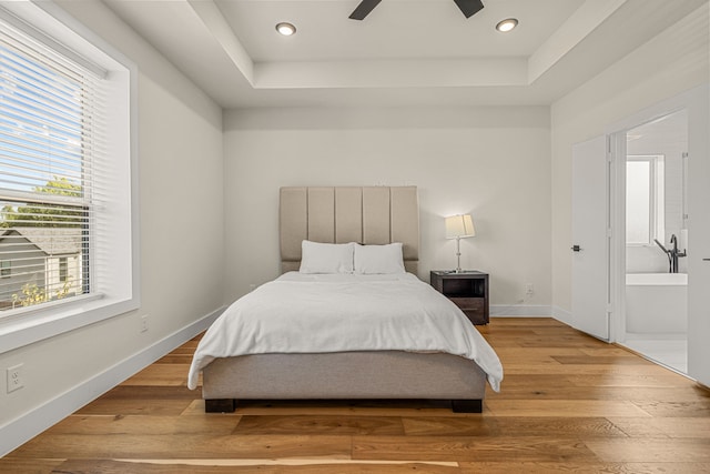 920 Muncie Ave, Dallas, TX 75212 - bedroom featuring wood finished floors, baseboards, a raised ceiling, ceiling fan, and recessed lighting