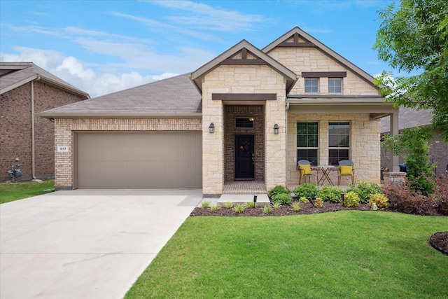 517 Big Horn Pass, Denton, TX 76210 - french provincial home with stone siding, a front lawn, a garage, driveway, and covered porch