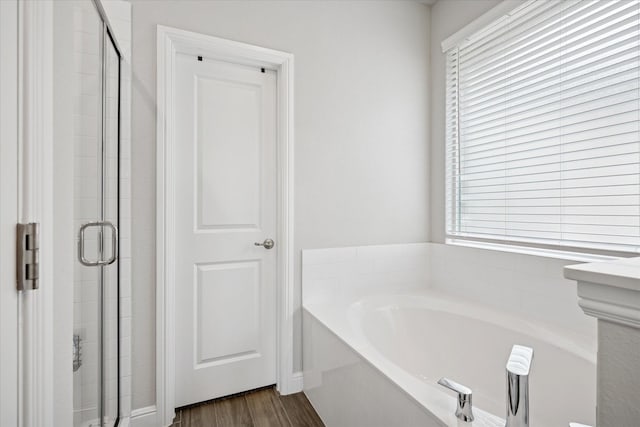 517 Big Horn Pass, Denton, TX 76210 - full bath with a bath, a stall shower, and wood finished floors