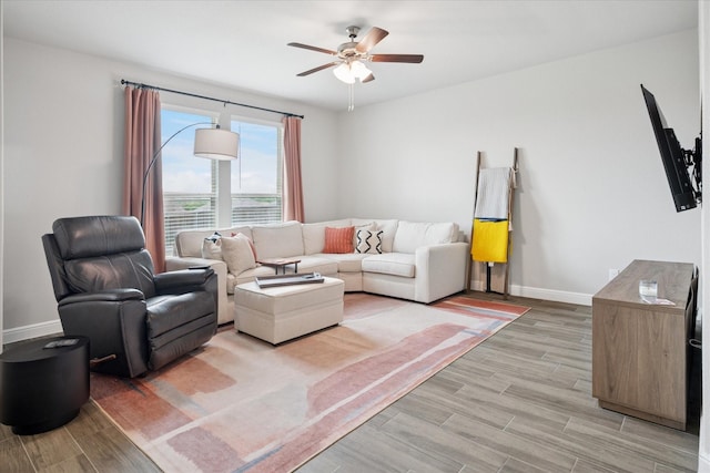 517 Big Horn Pass, Denton, TX 76210 - living room featuring baseboards, ceiling fan, and light wood-style floors