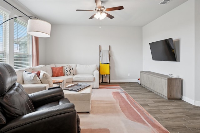 517 Big Horn Pass, Denton, TX 76210 - living room with wood finished floors, baseboards, and a ceiling fan