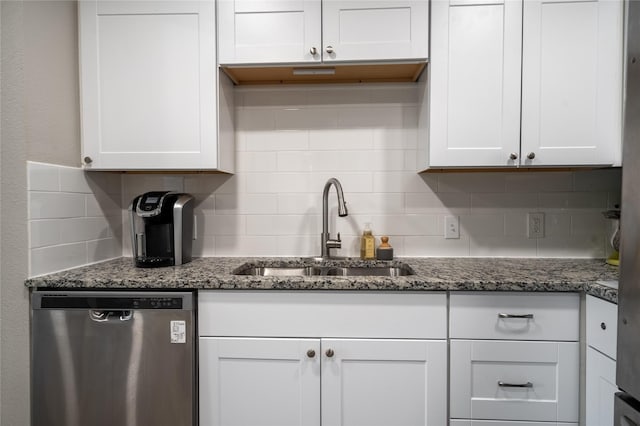 1306 S Oak Cliff Blvd, Dallas, TX 75208 - kitchen with dishwasher, a sink, backsplash, and white cabinets