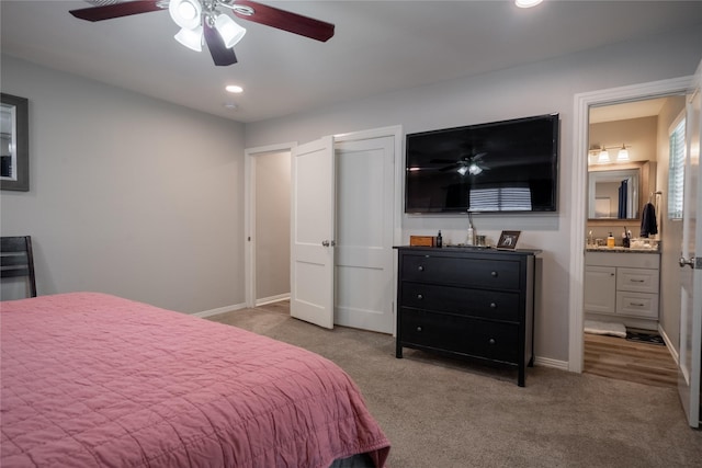 1306 S Oak Cliff Blvd, Dallas, TX 75208 - bedroom with carpet flooring, connected bathroom, a ceiling fan, baseboards, and recessed lighting