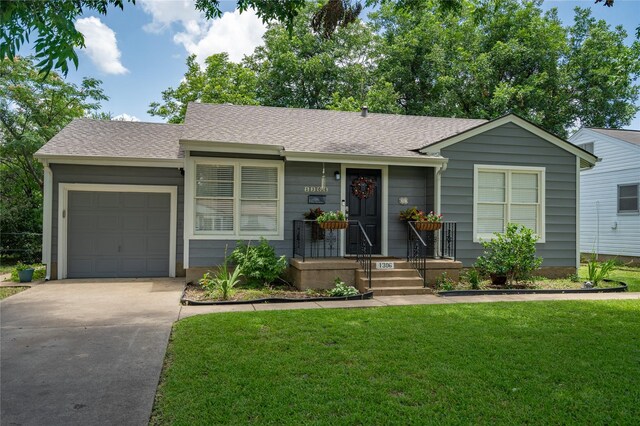 1306 S Oak Cliff Blvd, Dallas, TX 75208 - single story home with driveway, an attached garage, a front yard, and a shingled roof