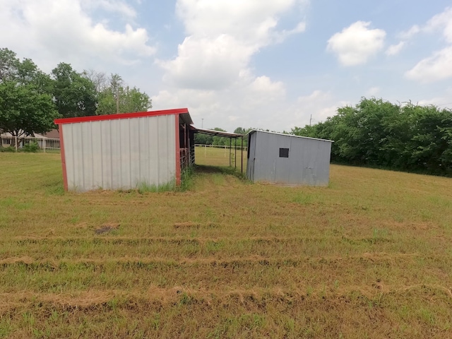 677 Fm 3356, Van Alstyne, TX 75495 - view of green lawn with a pole building and an outbuilding