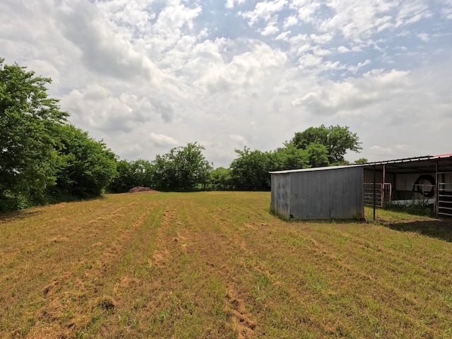 677 Fm 3356, Van Alstyne, TX 75495 - view of green lawn with a pole building and an outbuilding