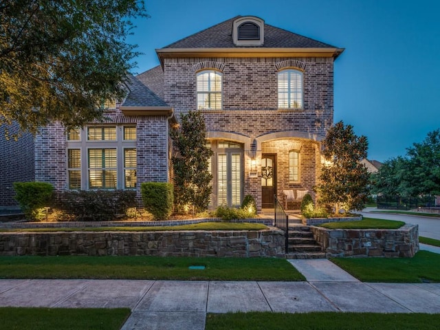 5717 Dr Kenneth Cooper Dr, Mckinney, TX 75070 - french country style house with brick siding and a front yard