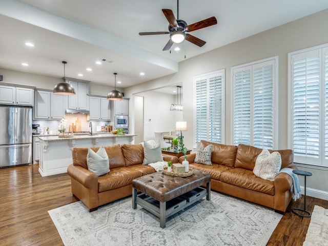 5717 Dr Kenneth Cooper Dr, Mckinney, TX 75070 - living room with wood finished floors, ceiling fan, recessed lighting, and baseboards
