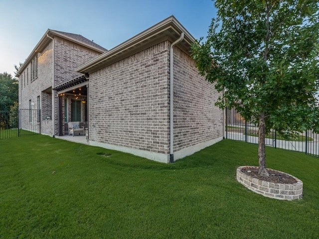 5717 Dr Kenneth Cooper Dr, Mckinney, TX 75070 - view of side of home featuring brick siding and a patio