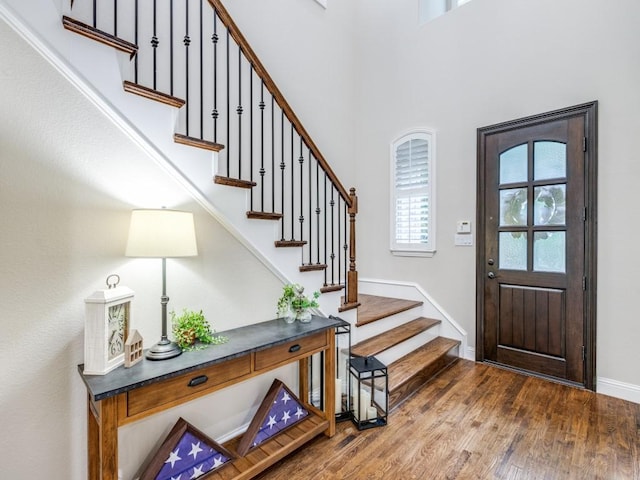 5717 Dr Kenneth Cooper Dr, Mckinney, TX 75070 - entrance foyer with stairs, wood finished floors, and baseboards
