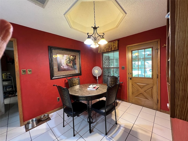 2101 Chase Bnd, Shreveport, LA 71118 - dining area with a textured ceiling, light tile patterned flooring, and a chandelier