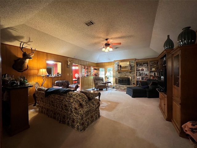 2101 Chase Bnd, Shreveport, LA 71118 - living room with lofted ceiling, ceiling fan, a textured ceiling, light carpet, and wood walls