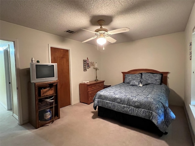 2101 Chase Bnd, Shreveport, LA 71118 - bedroom featuring light carpet, a textured ceiling, and a ceiling fan