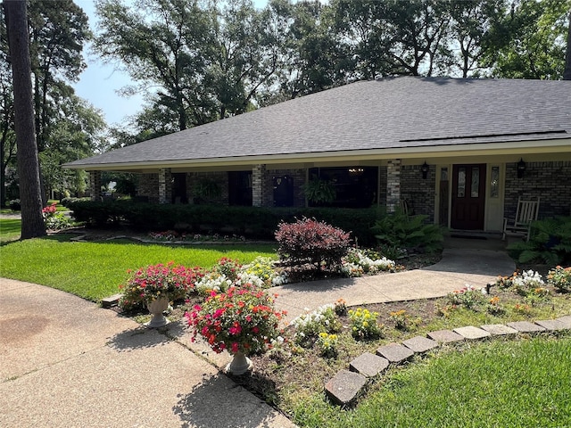 2101 Chase Bnd, Shreveport, LA 71118 - ranch-style home featuring roof with shingles, a front yard, and brick siding