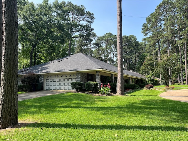 2101 Chase Bnd, Shreveport, LA 71118 - view of side of property featuring an attached garage, a lawn, driveway, and roof with shingles