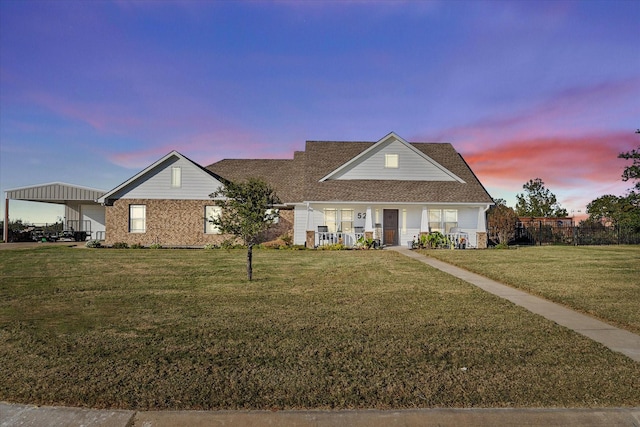 528 Hubbard Cir, Nevada, TX 75173 - view of front of property with covered porch, a lawn, brick siding, a shingled roof, and a carport