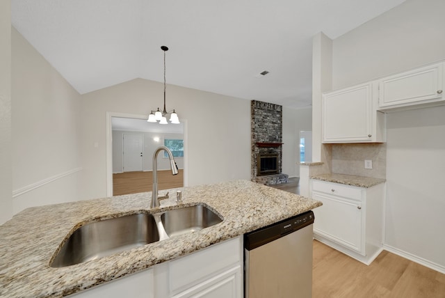 736 Lionel Way, Fort Worth, TX 76108 - kitchen featuring dishwasher, a sink, light wood-type flooring, white cabinets, and vaulted ceiling
