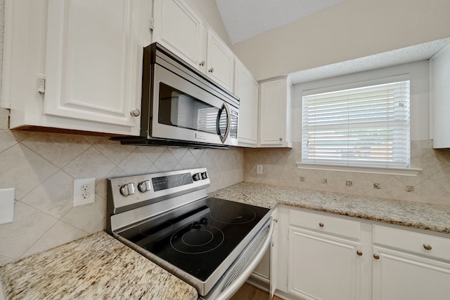 736 Lionel Way, Fort Worth, TX 76108 - kitchen featuring stainless steel appliances, white cabinetry, decorative backsplash, and light stone countertops