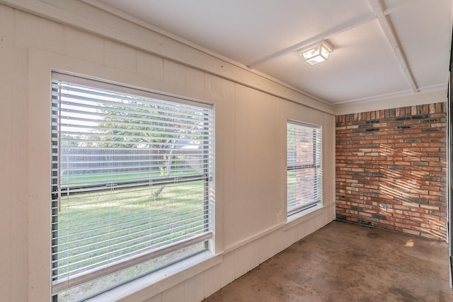 1510 Surry Place Dr, Cleburne, TX 76033 - empty room featuring unfinished concrete floors and brick wall