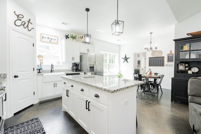 13530 Hiram Rd, Wills Point, TX 75169 - kitchen featuring stainless steel fridge with ice dispenser, concrete floors, and plenty of natural light